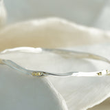 Elegant Sterling Silver Bangle with Brass Pips