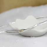 Elegant Sterling Silver Bangle with Brass Pips