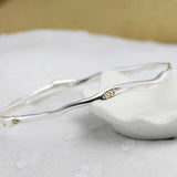 Elegant Sterling Silver Bangle with Brass Pips