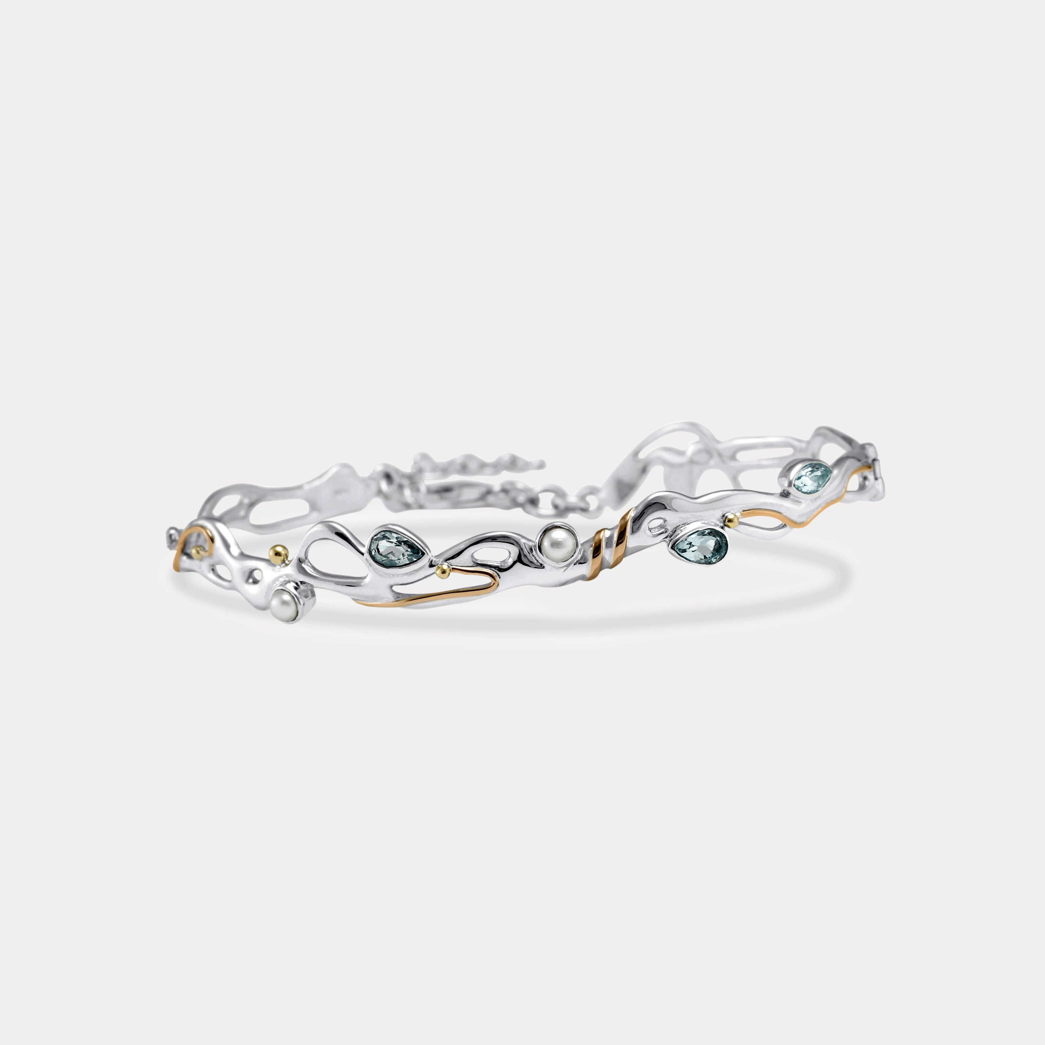 Blue Topaz and Pearl Sterling Silver bracelet on a white background