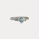 Blue Topaz Ring in Sterling Silver with Brass Details