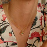 Gold Flower Pendant with Turquoise Stone