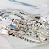 Handcrafted Sterling Silver Bangle with Gold Details