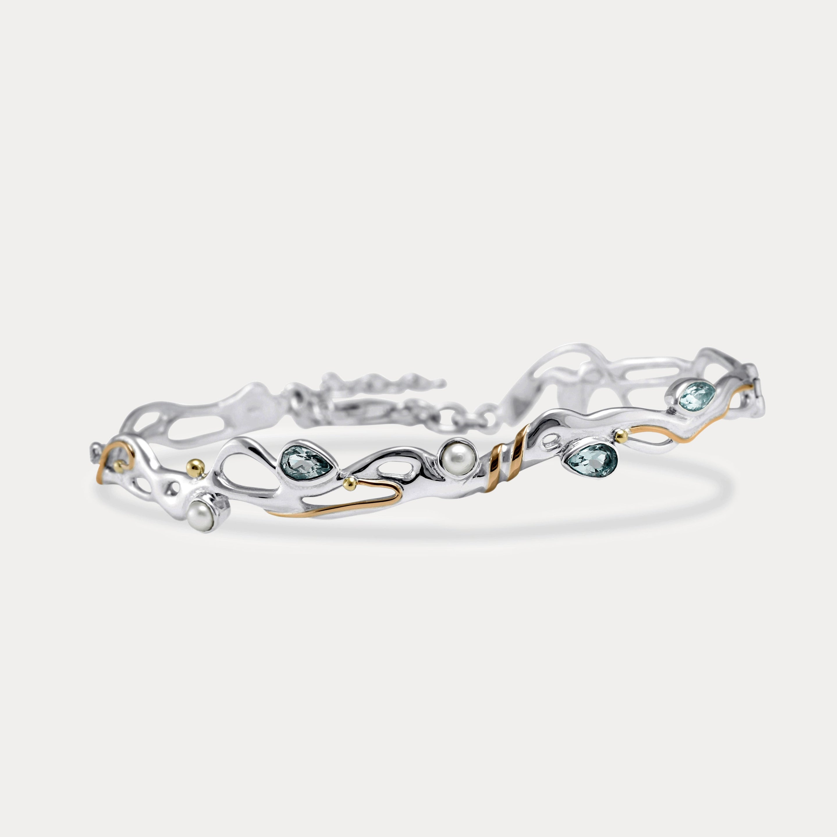 Blue Topaz and Pearl Sterling Silver bracelet on a white background