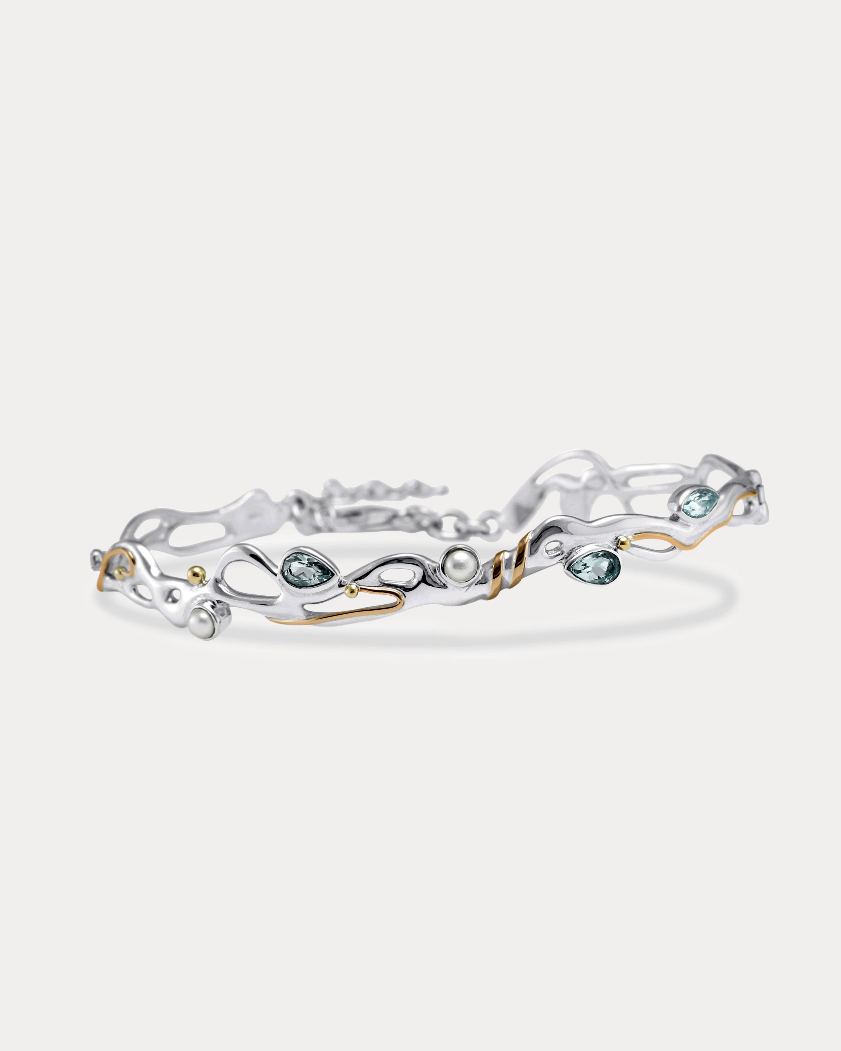 Blue Topaz and Pearl Sterling Silver bracelet on a white background