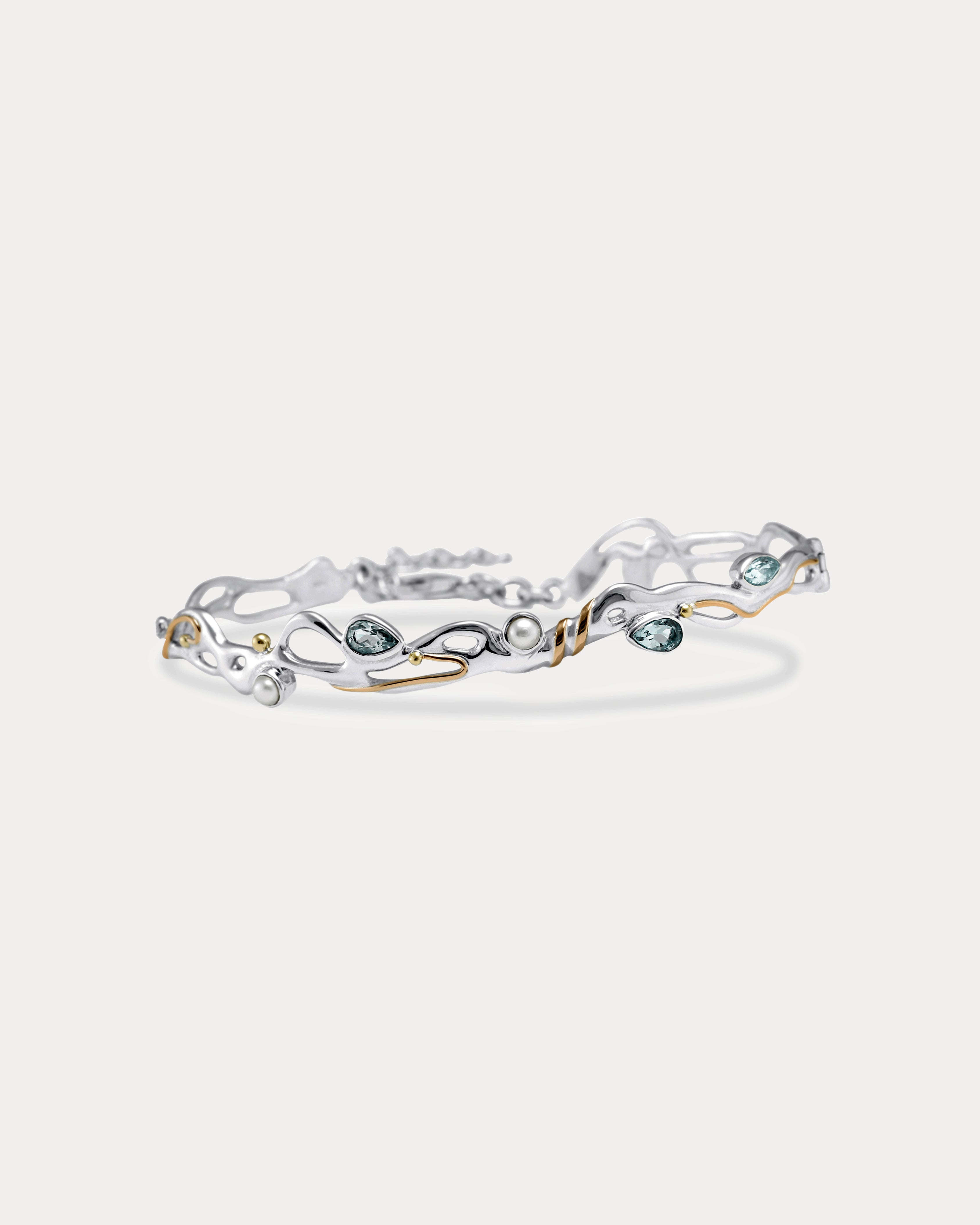 Blue Topaz and Pearl Sterling Silver bracelet on a white background