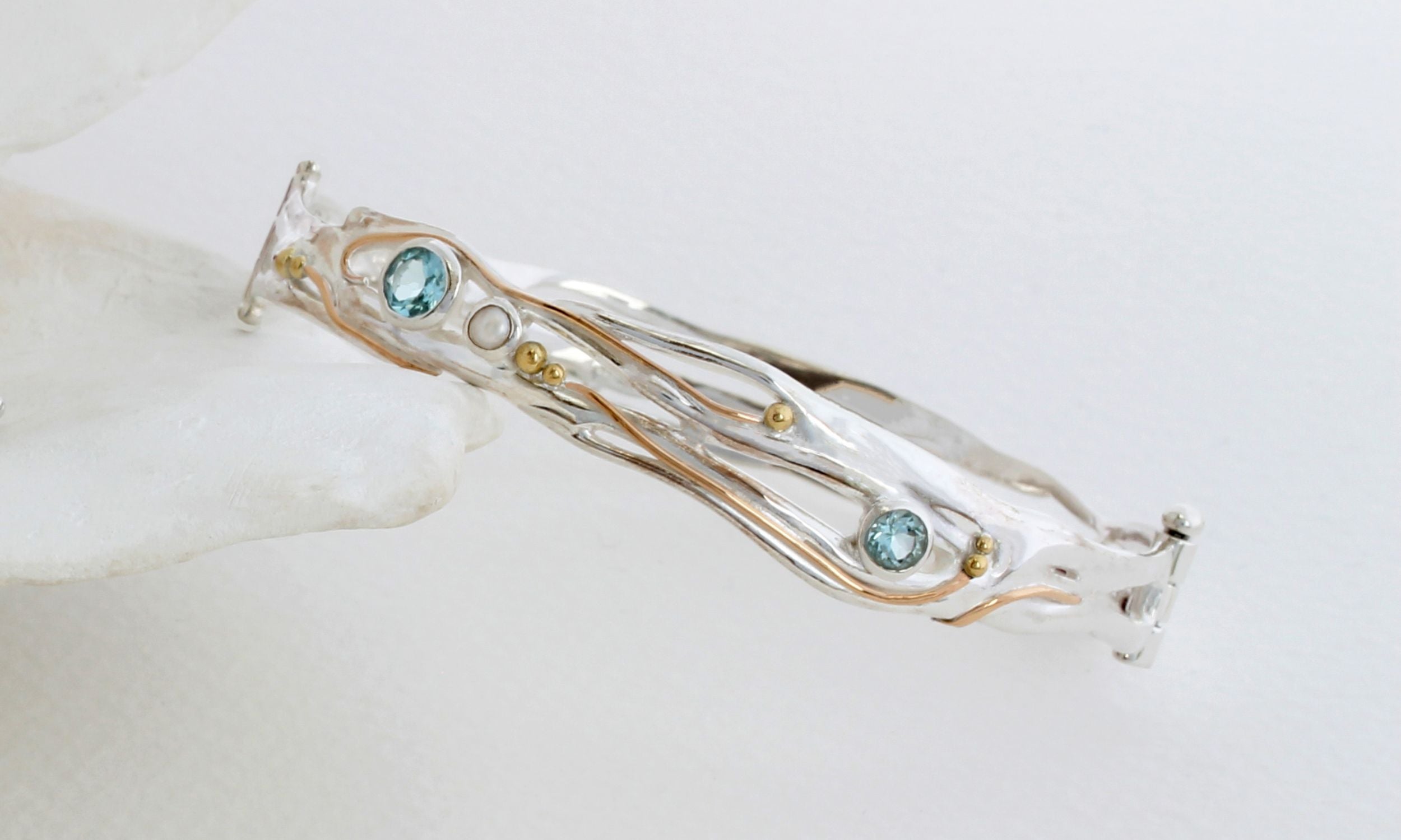 Sterling silver bracelet with blue topaz and freshwater pearl