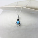 Sterling Silver Blue Fire Opal Earrings and Pendant with Flower Detail Set