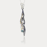 Handmade Flowing Silver Pendant with Blue Topaz and 14kt Gold Details