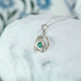 Silver and Gold Circular Emerald Pendant