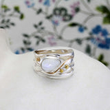 Rainbow Teardrop Moonstone Ring enhanced with 14ct gold detailing.