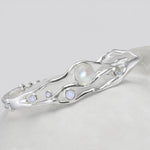 Silver bracelet with moonstones on a white background