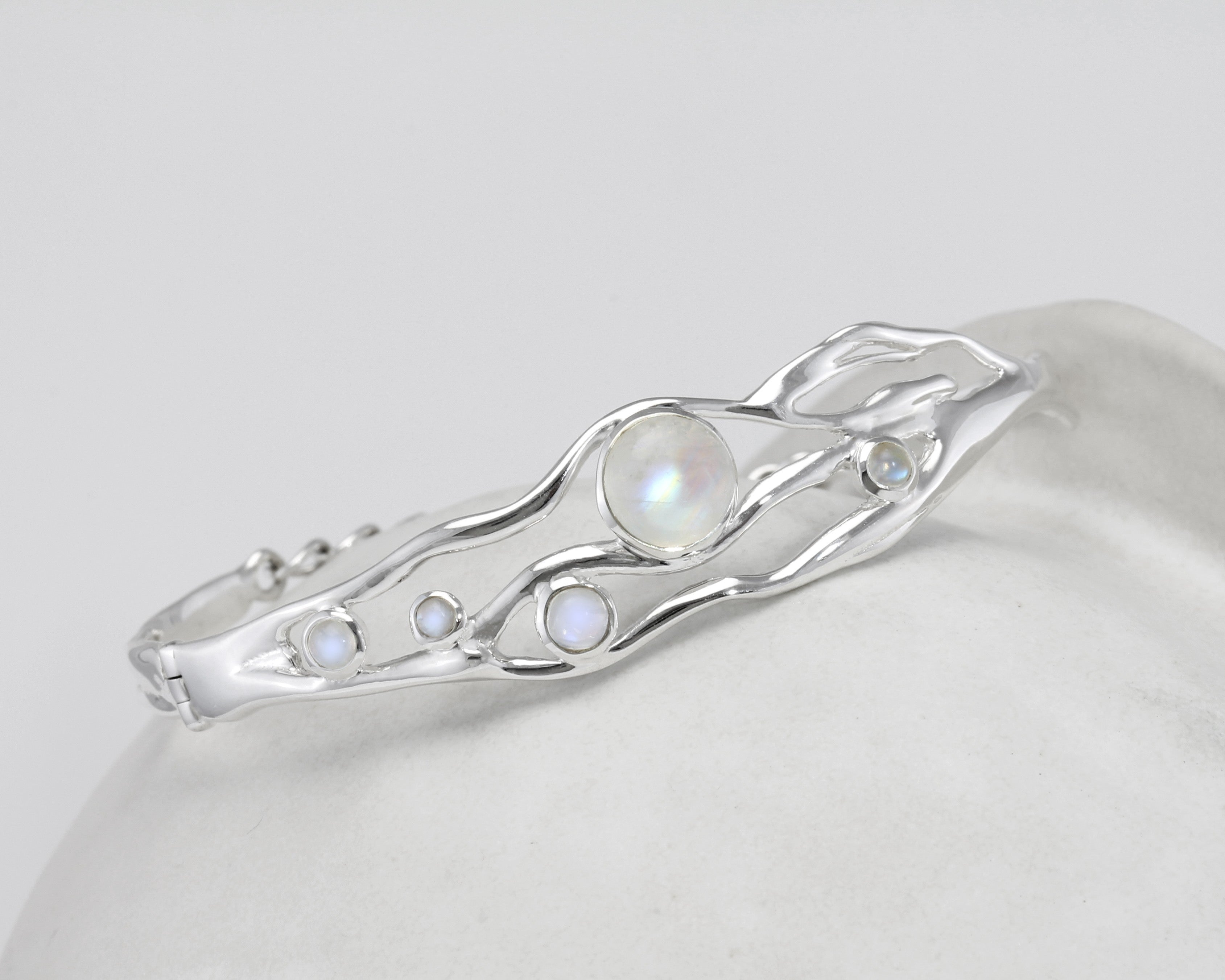 Silver bracelet with moonstones on a white background