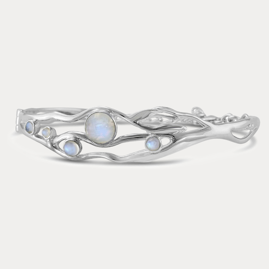 A Sterling Silver bangle bracelet with organic shape and five Moonstone gemstones set within the flowing Silver.