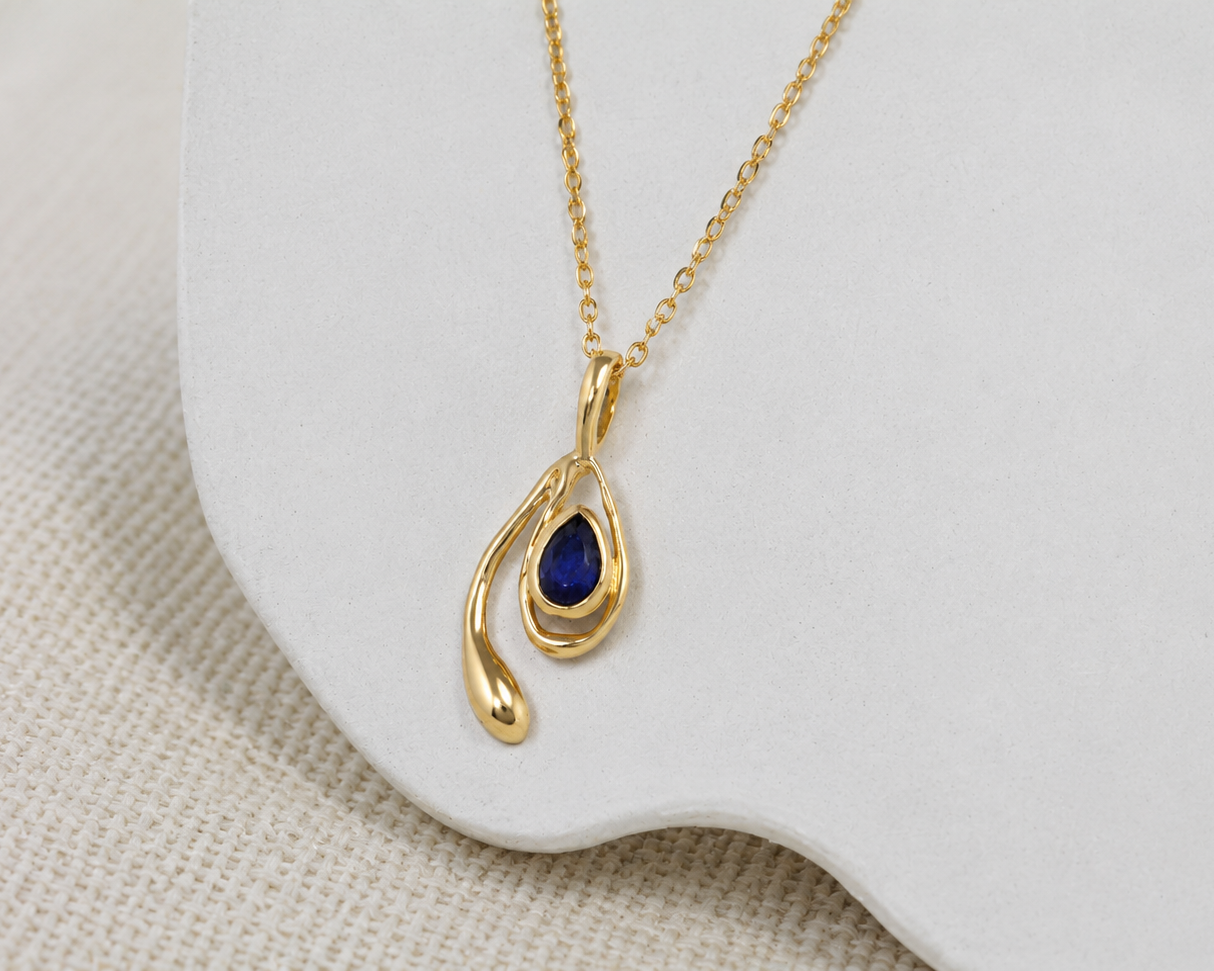 gold sapphire dainty pendant 