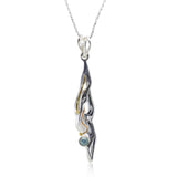 Handmade Flowing Silver Pendant with Blue Topaz and 14kt Gold Details