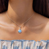 Handmade Sterling Silver Blue Fire Opal Pendant with Dainty Flower Detail