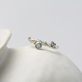 Flower silver ring with Faceted Rainbow Moonstone and Gold Details